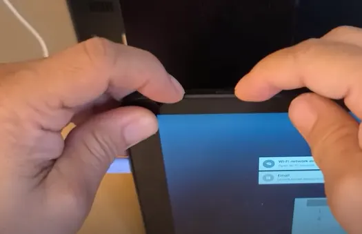 LG Tablet Holding Power and Volume Down Button